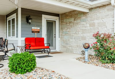 Cozy outdoor seating area with landscaping