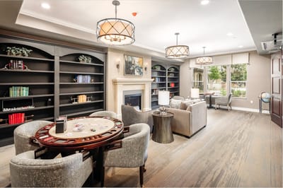 Bright common area with comfortable seating and games