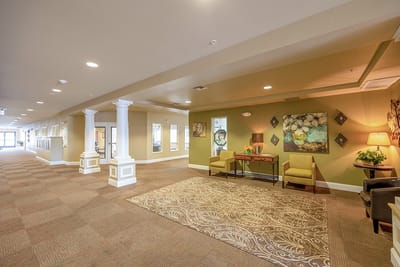Interior hallway of a seniors' living facility with seating