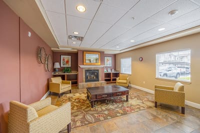 Interior common area with seating and a fireplace