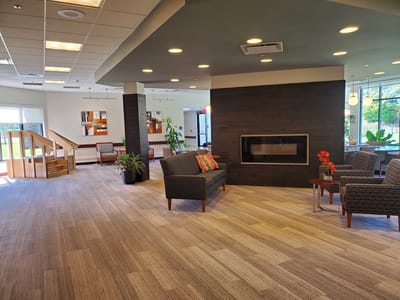 Interior view of a lounge area with seating and plants
