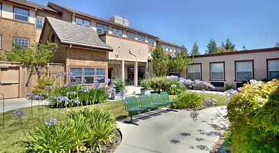Outdoor garden area with seating near the building