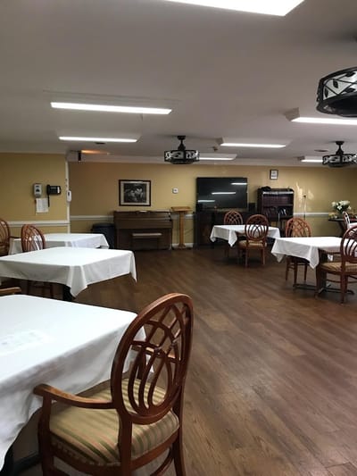 Dining area with tables and chairs in a cozy room