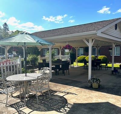Outdoor patio area with seating and shade