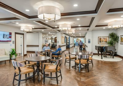Residents enjoying conversation in a cozy common area