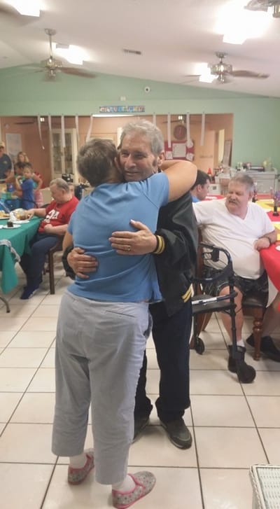 Residents enjoying a warm embrace during an activity