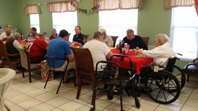 Residents enjoying a meal together in a dining area