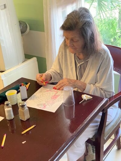 Resident engaged in arts and crafts activity