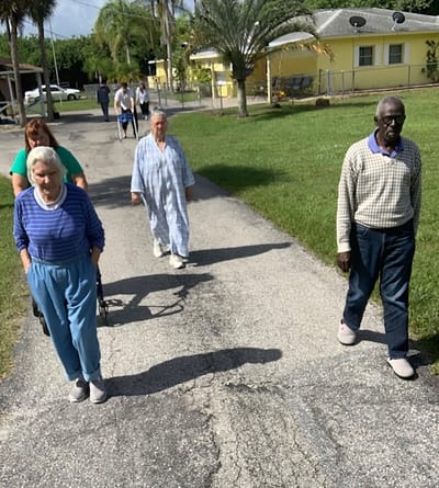 Residents walking outside in a community setting