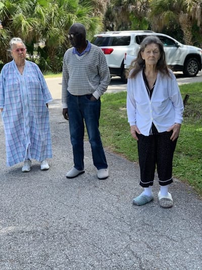 Three residents enjoying time outdoors