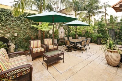 Outdoor seating area with umbrellas and plants