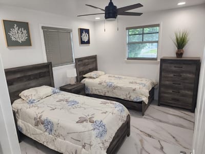 Bright, spacious shared bedroom with two beds