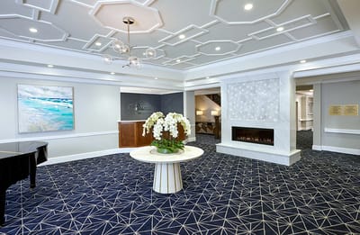 Interior view of a lobby with floral decor and seating