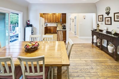 Interior view of a dining area with wooden table and chairs