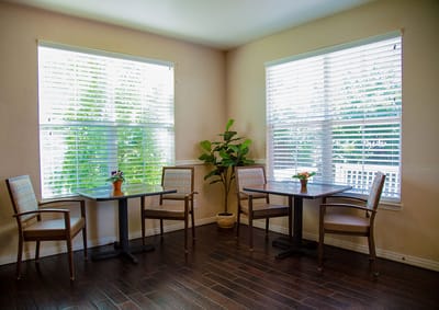 Cozy common area with seating and large windows.