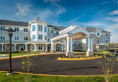 Exterior view of the facility with landscaped entrance