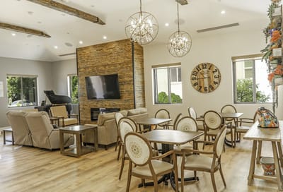 Common area with seating and decor in a senior facility