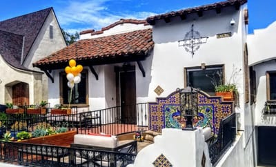 Exterior view of a senior living facility with outdoor decor