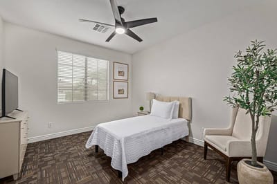 Private resident room featuring bed and decor