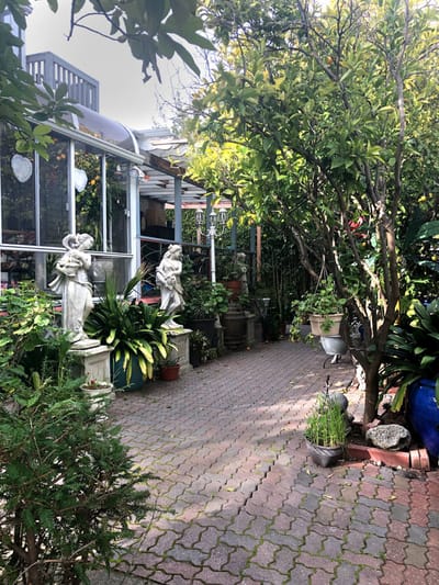 Serene outdoor garden space with statues
