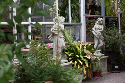 Garden area with decorative statues and plants