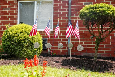 Outdoor garden area with American flags