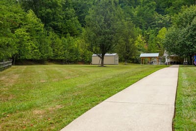 Pathway leading to outdoor space in a landscaped area