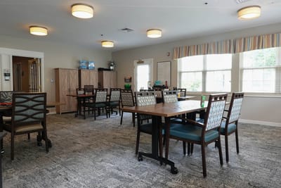 Bright dining area with tables and chairs