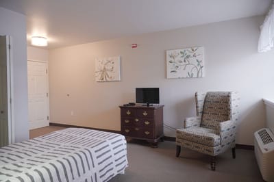 Bright interior of a resident room with furniture