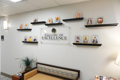 Interior view of a recognition gallery with resident photos