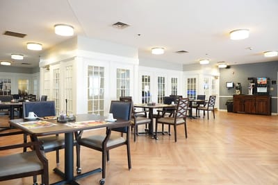 Bright dining area with tables and chairs