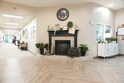 Interior view of a cozy common area with a fireplace