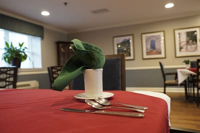 Dining table set with utensils in an inviting dining area