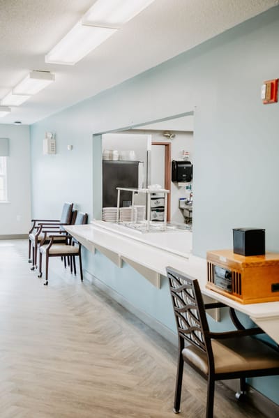 Interior view of a dining area with serving window