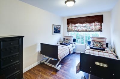 Private resident room with two hospital beds