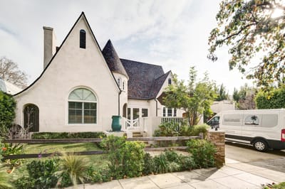Exterior view of Raya's Paradise facility with garden