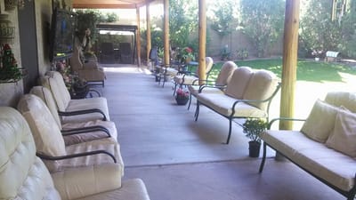 Outdoor seating area with plants and decor