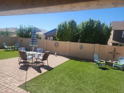 Sunny outdoor space with seating and landscaping