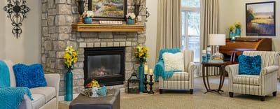 Cozy interior common area with a fireplace and seating