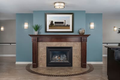 Cozy common area with fireplace and artwork