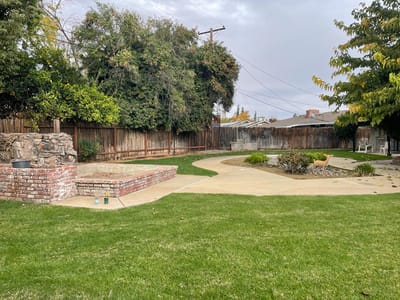 Well-maintained outdoor space with paths and landscaping