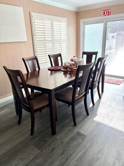 A well-set dining table in a bright room