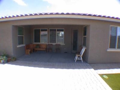 Outdoor patio area with seating and plants