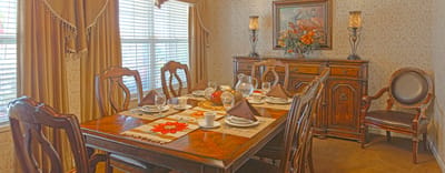 A beautifully set dining room with tableware