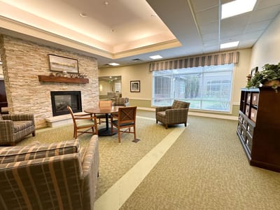 Comfortable interior lounge with seating by a fireplace