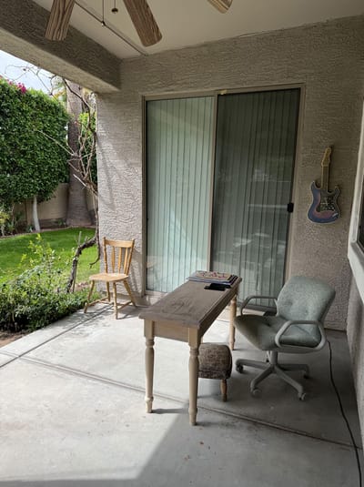 Outdoor seating area with table and chairs
