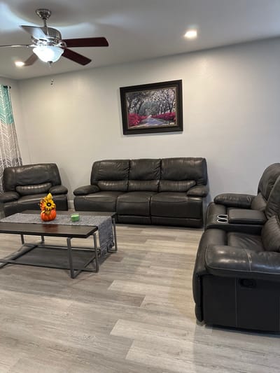 Interior lounge area with leather seating and artwork