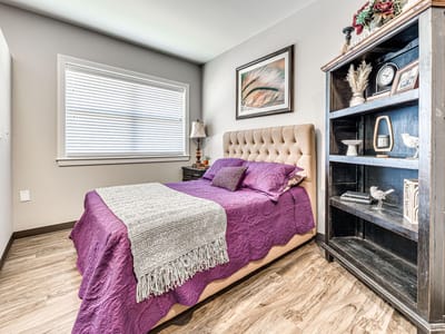 Cozy private bedroom with a purple accent theme