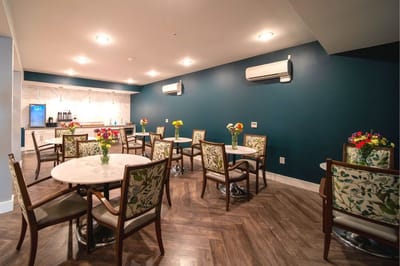 Bright dining area with floral arrangements on tables