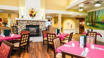 Bright dining room with tables set for meals